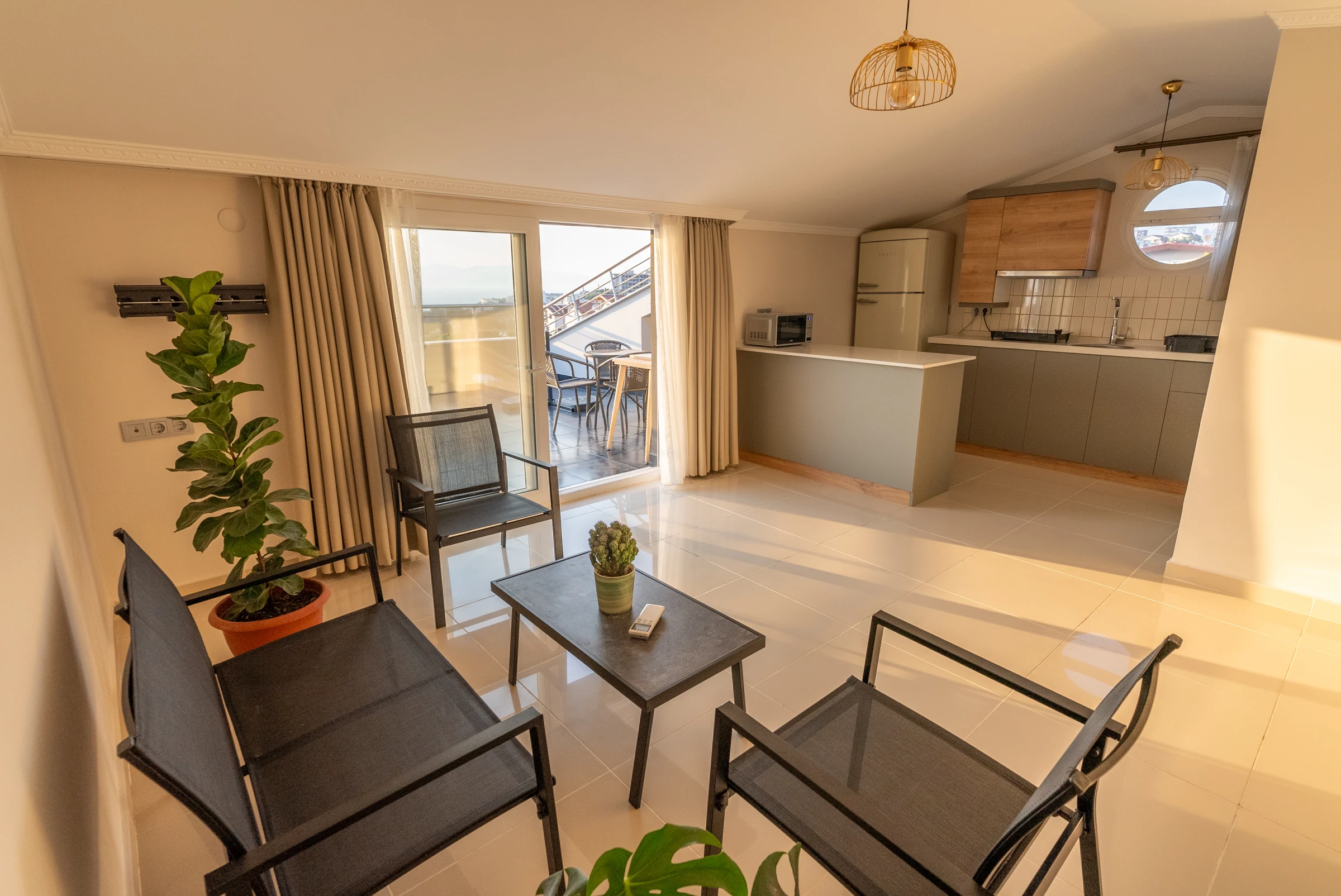 Representative Soul House living space with seating, kitchen, and balcony doors